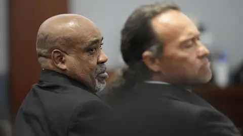 Witness gets combative in Tupac murder trial - 'I don't want to send him to prison' Getty Images Duane Davis, left, looks on during his murder trial, related to the 1996 killing of rapper Tupac Shakur, at the Clark County District Court at the Regional Justice Center in Las Vegas, Nevada, on 18 August 2026.