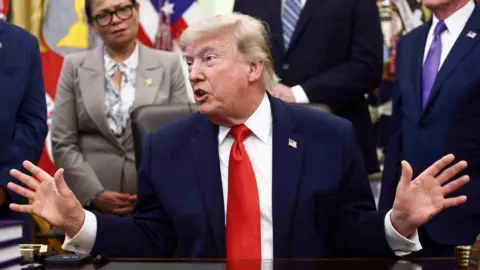 Israel carries out air strikes on Lebanon, state media says, as Iran claims deal with US near Getty Images US President Donald Trump speaking in the Oval Office surrounded by people listening