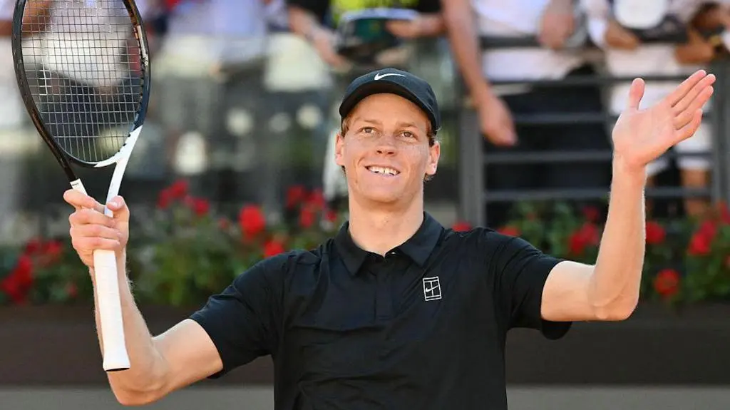 Jannik Sinner celebrates beating Alexei Popyrin