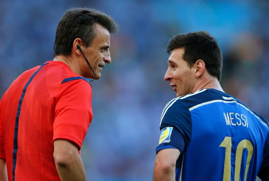Argentina superstar Lionel Messi talking to assistant referee Renato Faverani during the 2014 World Cup Final between Germany and Argentina.