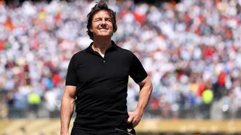 Getty Images Tom Cruise speaks before the FIFA World Cup 2026 Final match between Spain and Argentina