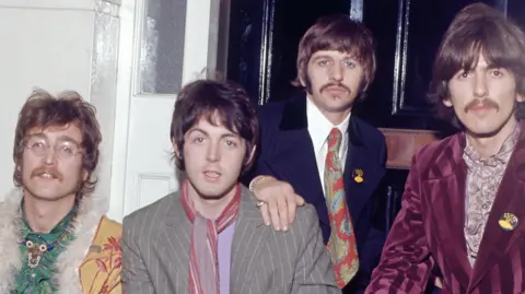 Getty Images (Left to right) A colourfully dressed John Lennon, Paul McCartney, Ringo Starr and George Harrison sat outside the London home of manager Brian Epstein in support of the release of Sgt. Pepper's Lonely Hearts Club Band in May 1967