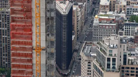 Would you pay $58.5m to live in this iconic New York building? Getty Images Aerial view of the building covered in dark material