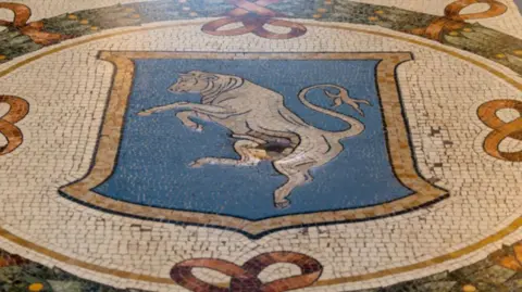 Italy restores lucky testicles on bull mosaic worn down by tourists Getty Images A small crater in the centre of the bull mosaic in the Galleria Vittorio Emanuele II in Milan, Italy.