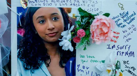 Singer D4vd arrested in connection with death of missing teen girl Getty Images Photo of young woman with long wavy black hair surrounded by messages in Spanish and English written around it on a white board, and flowers pinned in places