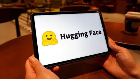 OpenAI says its rogue AI tried to hack other companies Getty Images The Hugging Face logo shown on a tablet screen. It is a yellow emoji of a smiling face with its hands spread out in front of it.