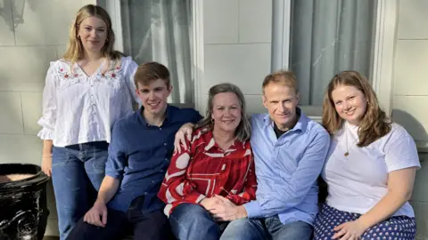 Supplied The Scolyer family sit and pose for a photo