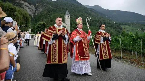 AFP via Getty Images Spanish-born traditionalist Catholic Bishop of the Society of Saint Pius X (SSPX) Alfonso de Galarreta walks during a procession prior to the schismatic consecration of bishops by the traditionalist Catholic Society of Saint Pius X (SSPX) in Écône, western Switzerland, on July 1, 2026