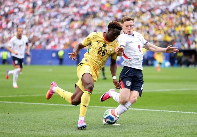 FOXBOROUGH, MASSACHUSETTS - JUNE 23: Marvin Senaya #26 of Ghana controls the ball against Elliot Anderson #8 of England  during the FIFA World Cup 2026 Group L match between England and Ghana at Boston Stadium on June 23, 2026 in Foxborough, Massachusetts. (Photo by Justin Setterfield/Getty Images)