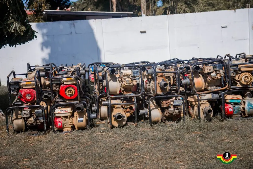 NAIMOS hands over 100 seized galamsey pumping machines to NSA for agriculture project