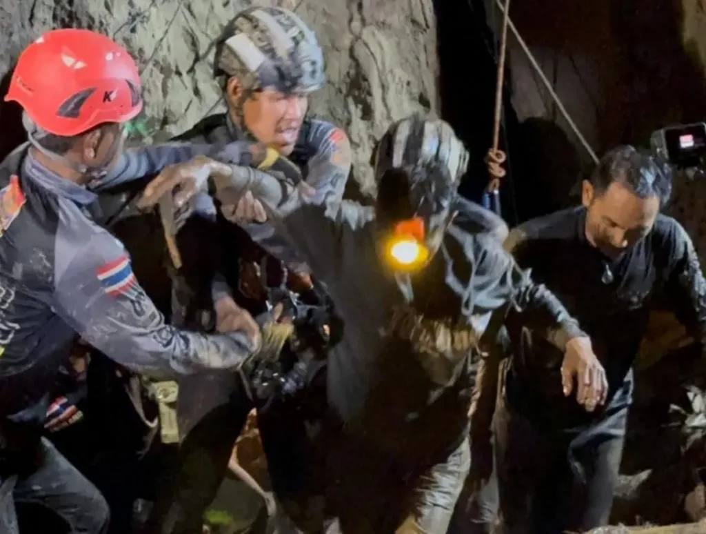 First of five men found alive in flooded Laos cave rescued