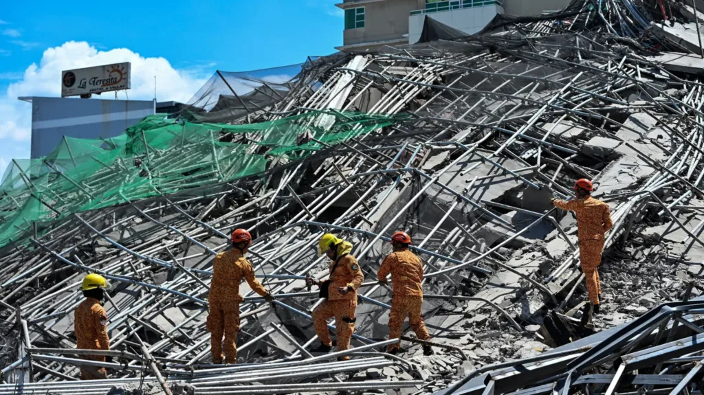 One killed and many feared trapped under collapsed building in Philippines