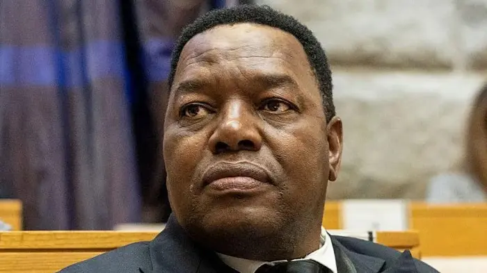 South Africa’s police boss charged in connection with controversial health contract