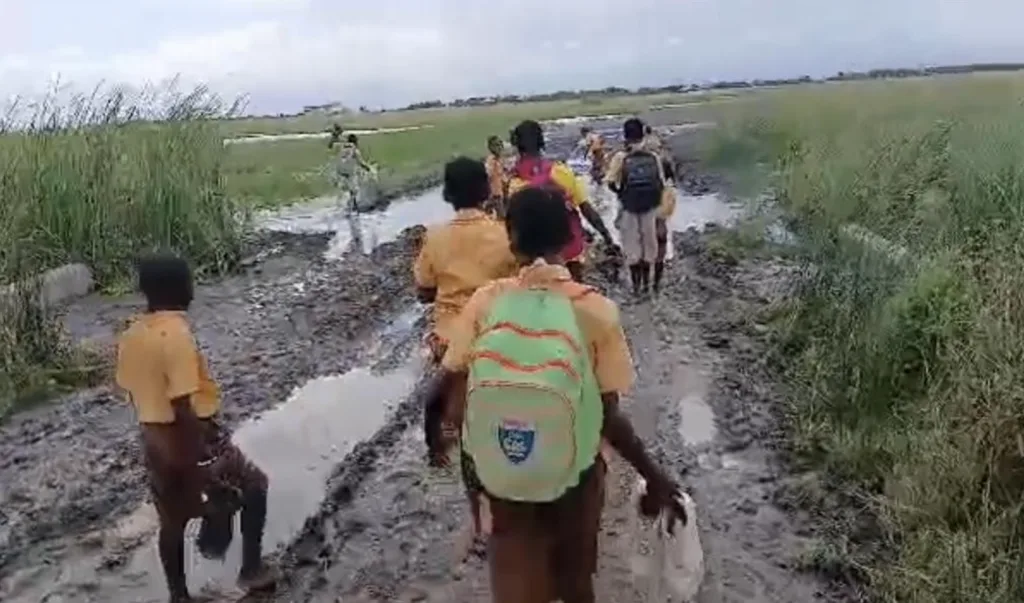 Midie schoolchildren wade through mud daily to access education