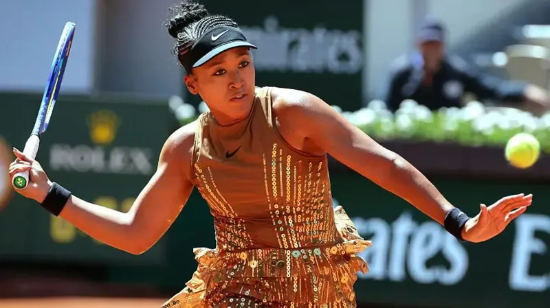 Osaka sparkles in golden French Open outfit
